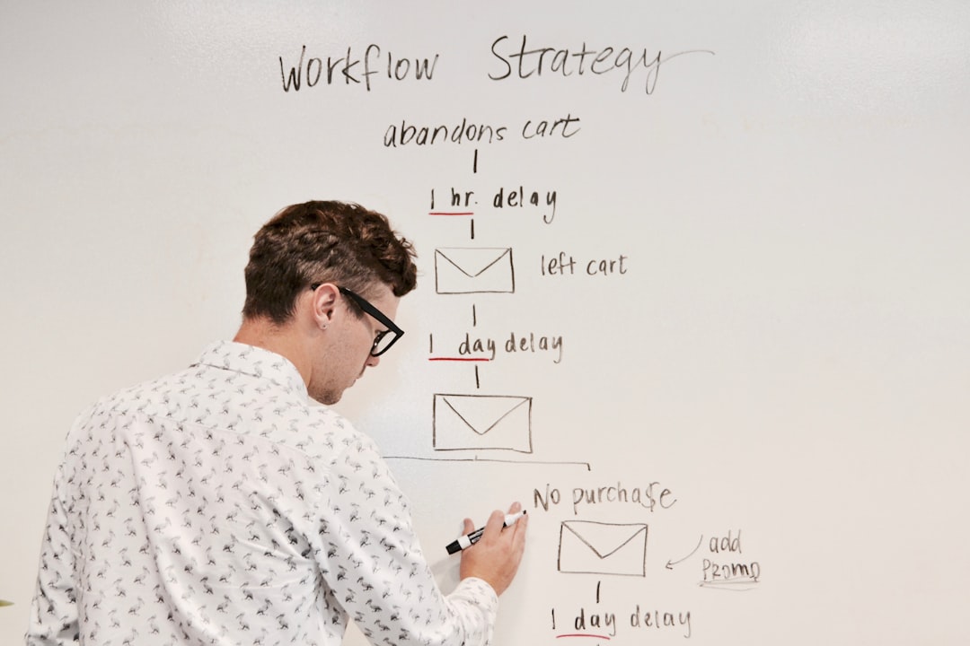 Man writing on white board