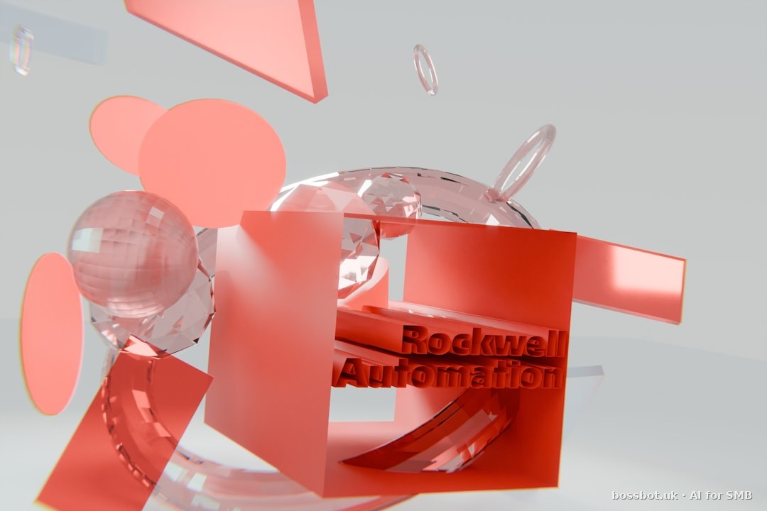 Red geometric shapes and glass spheres with "rockwell automation" text.