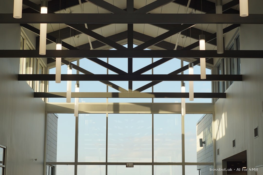 Modern building interior with skylights and glass walls.