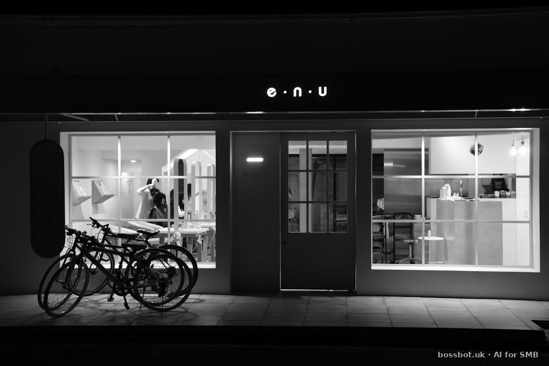 Storefront with bicycles parked in front at night.