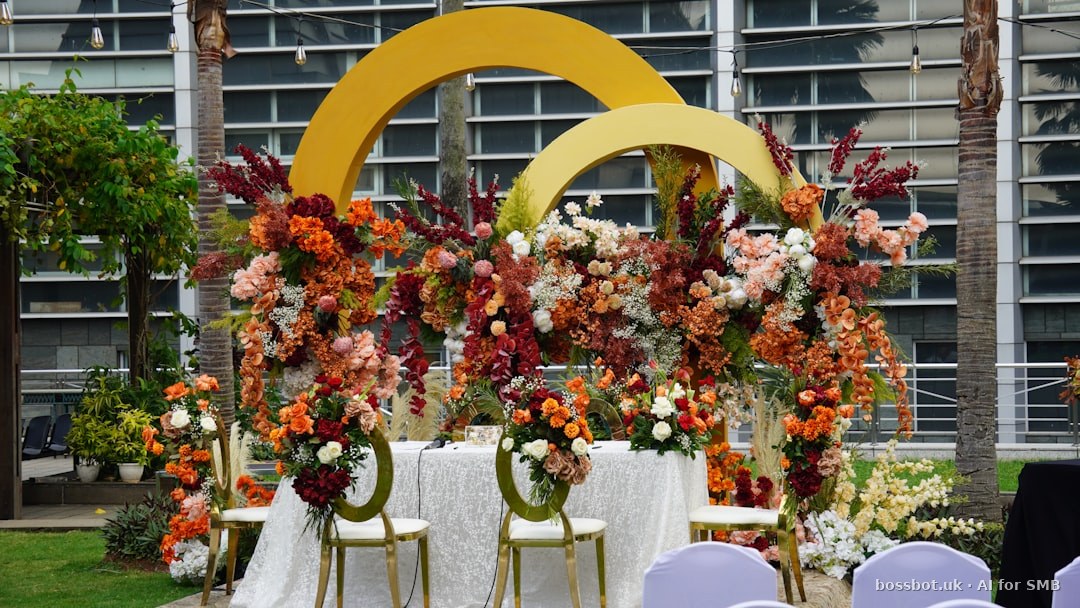 Floral arrangement decorates an outdoor event setup.