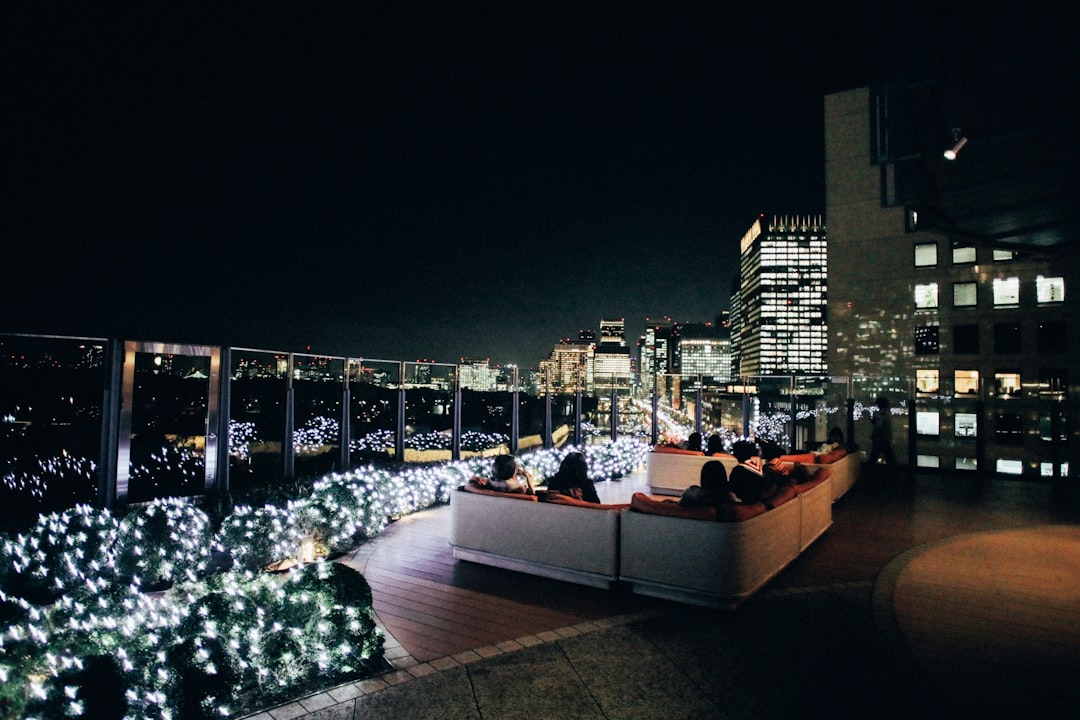 A night view of a rooftop restaurant.