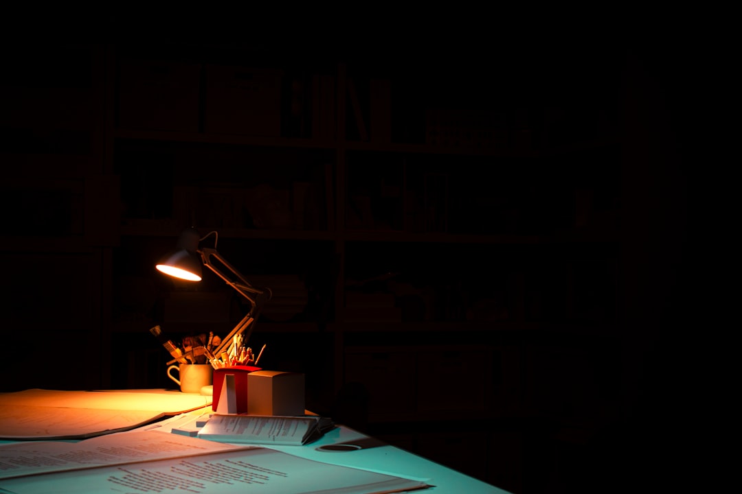 A table with a lit candle on top of it