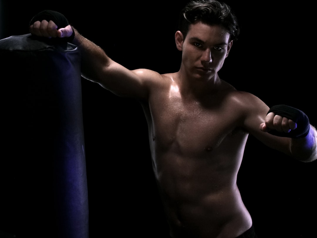 Topless man wearing black armbands