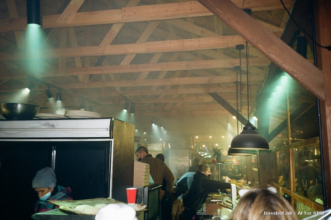 A group of people stand in a kitchen