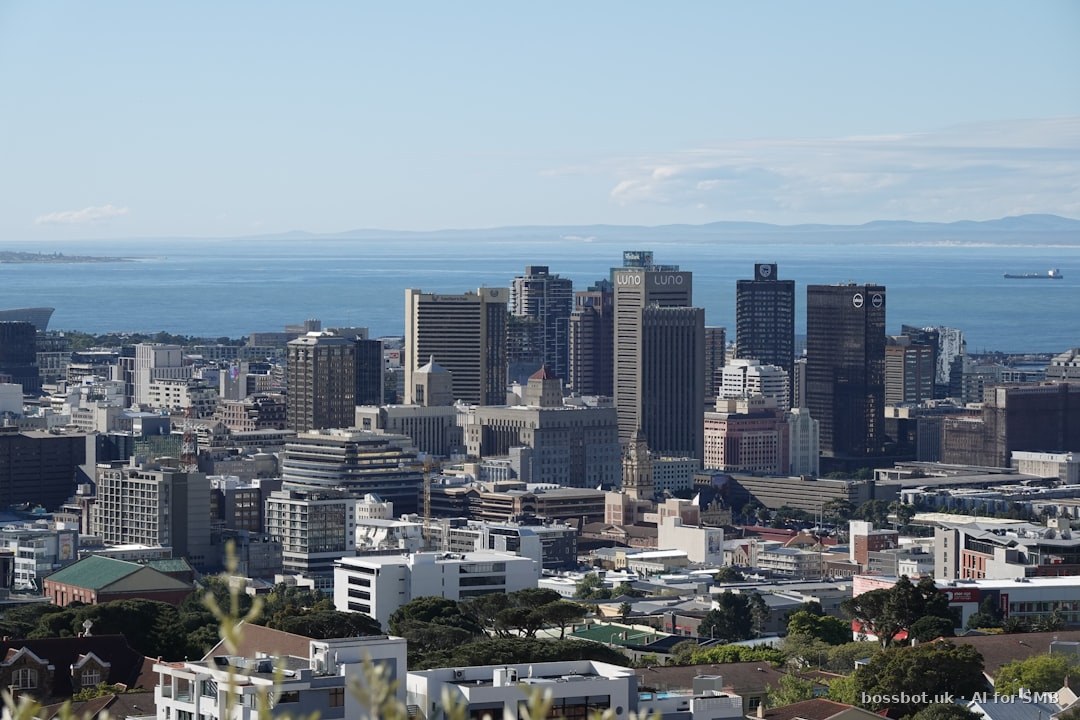 A view of a city with a large body of water in the background