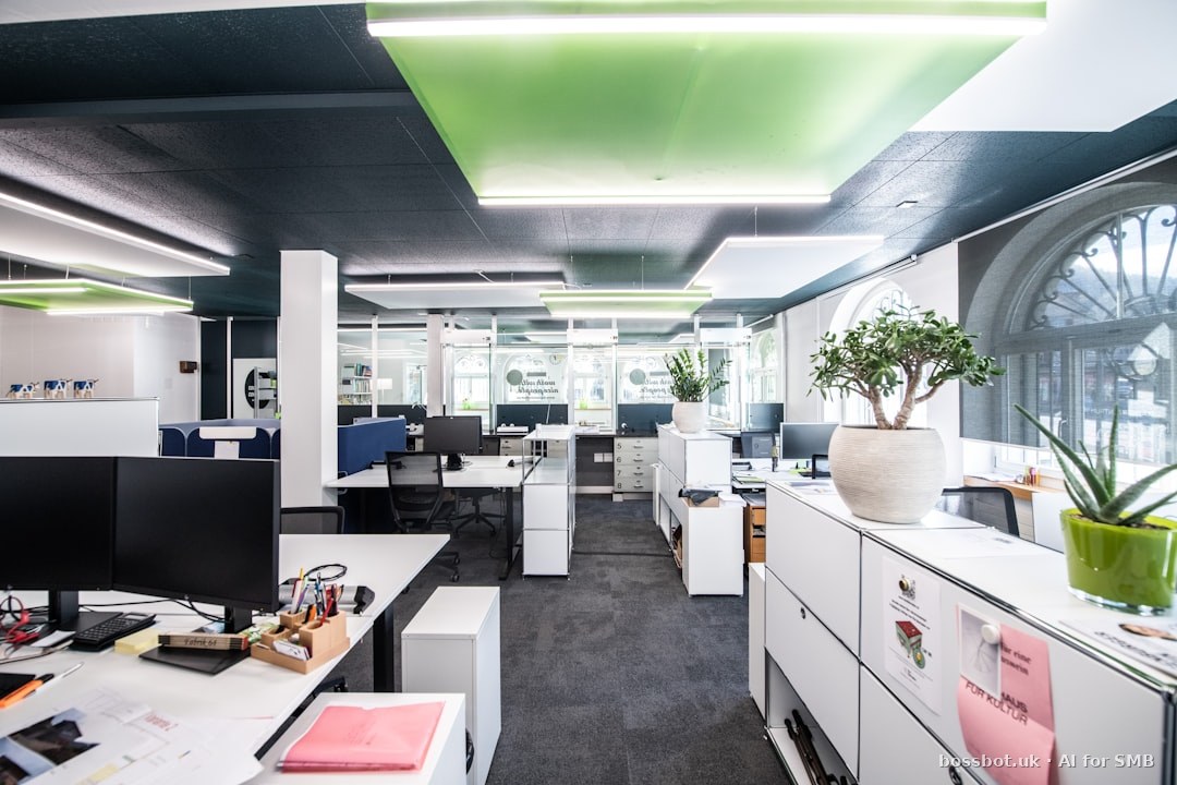 An office with white cabinets and desks