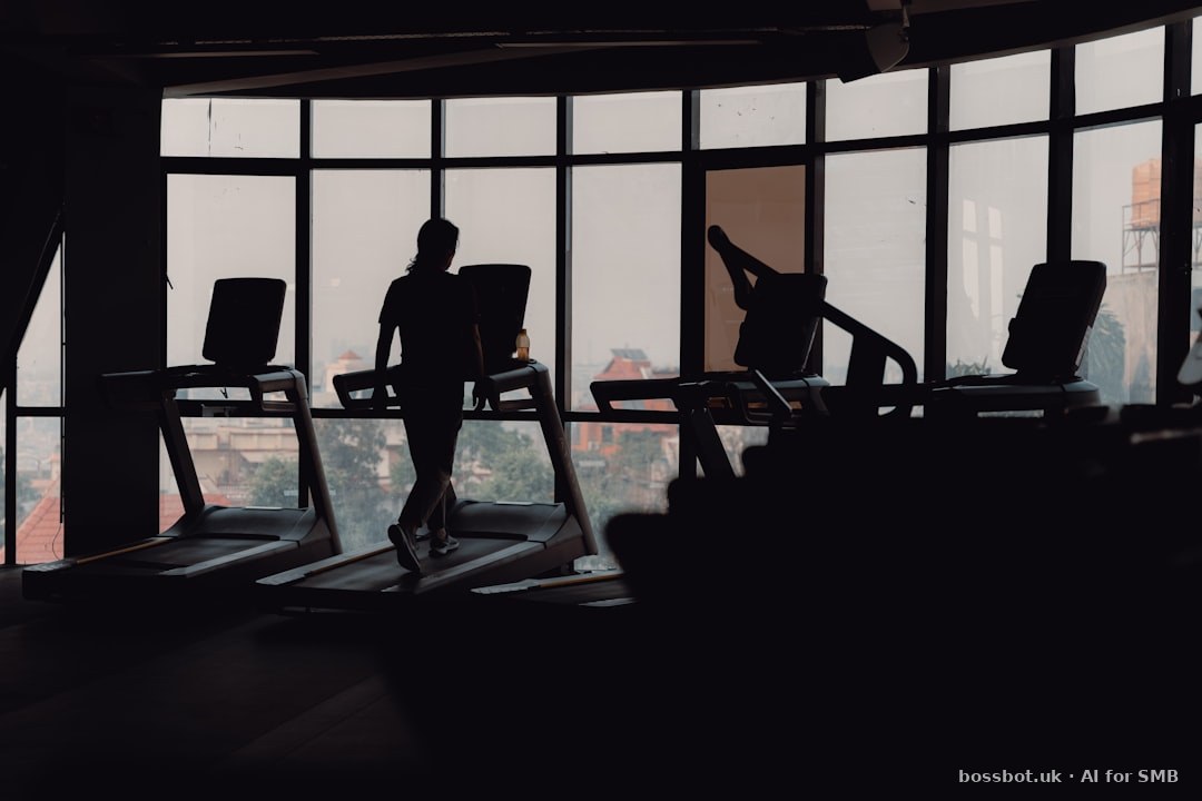 Boutique fitness studio with rowing machines and dumbbells