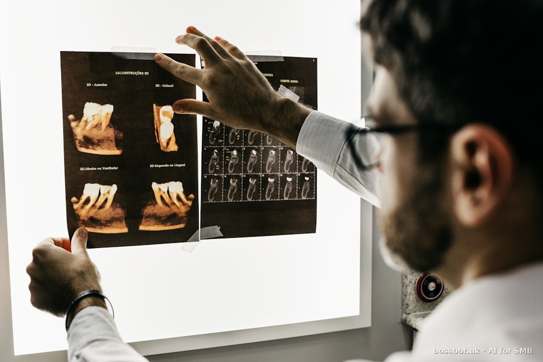 Person in gray long sleeve shirt holding black tablet computer