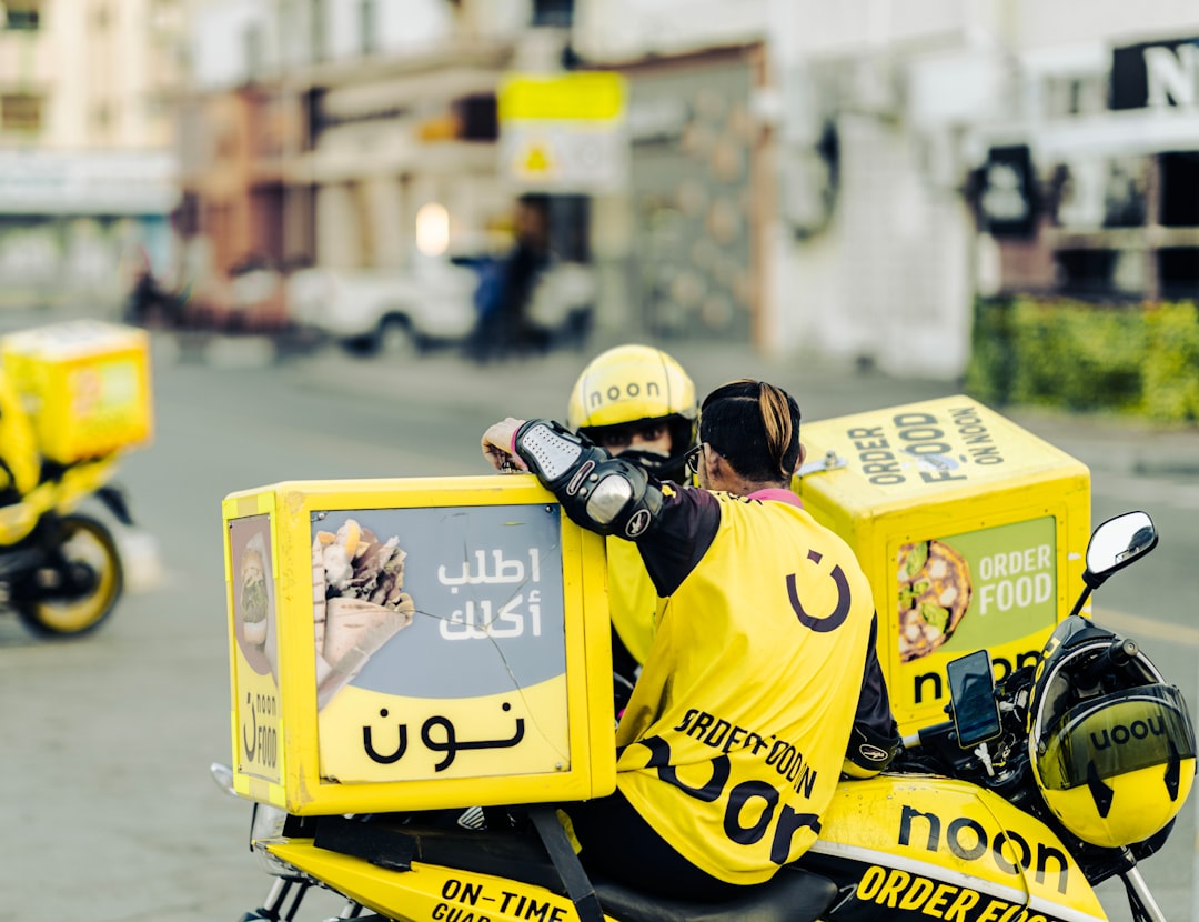 A couple of people on a motor bike