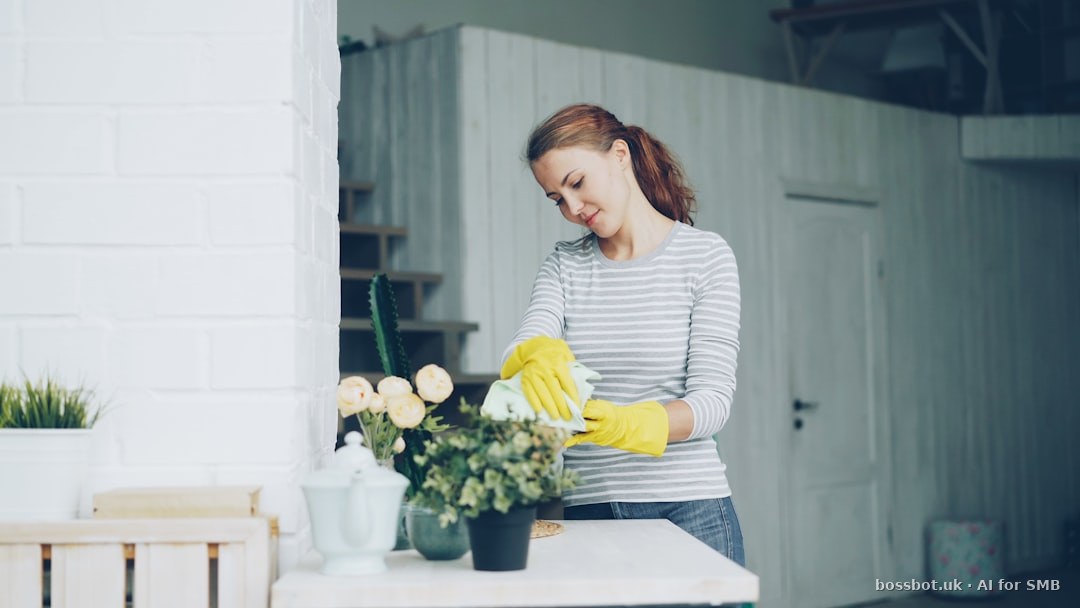 Cleaning company office manager sending WhatsApp booking confirmation to residential client in UK