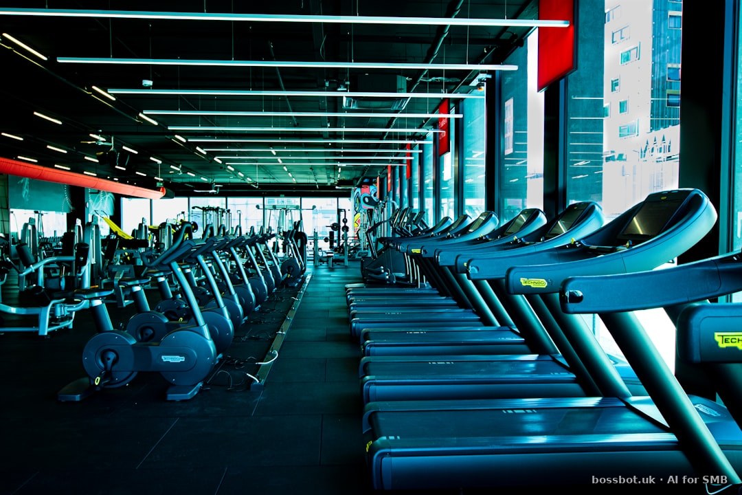 A row of exercise machines in a gym