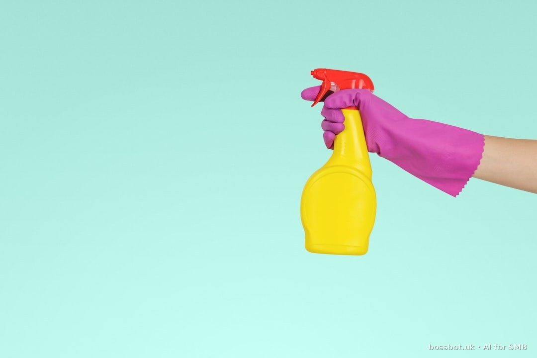Person holding yellow plastic spray bottle