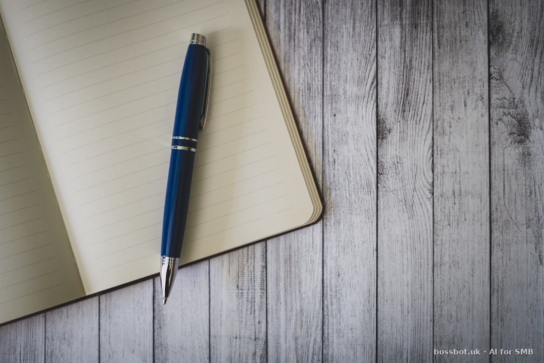 Blue click pen on brown wooden table