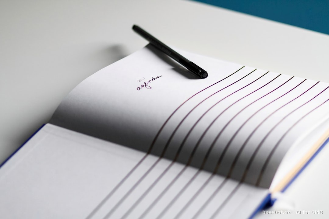 A notebook with a pen on top of it