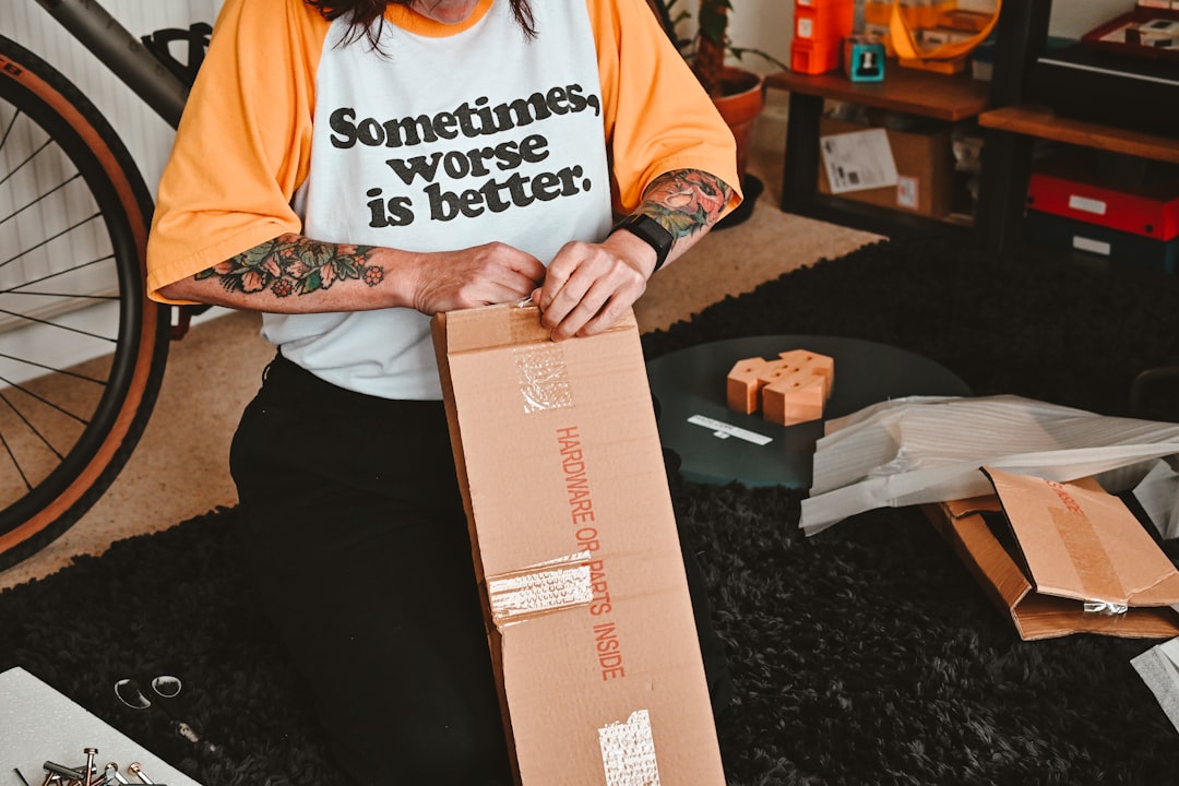 A person with a box on the lap