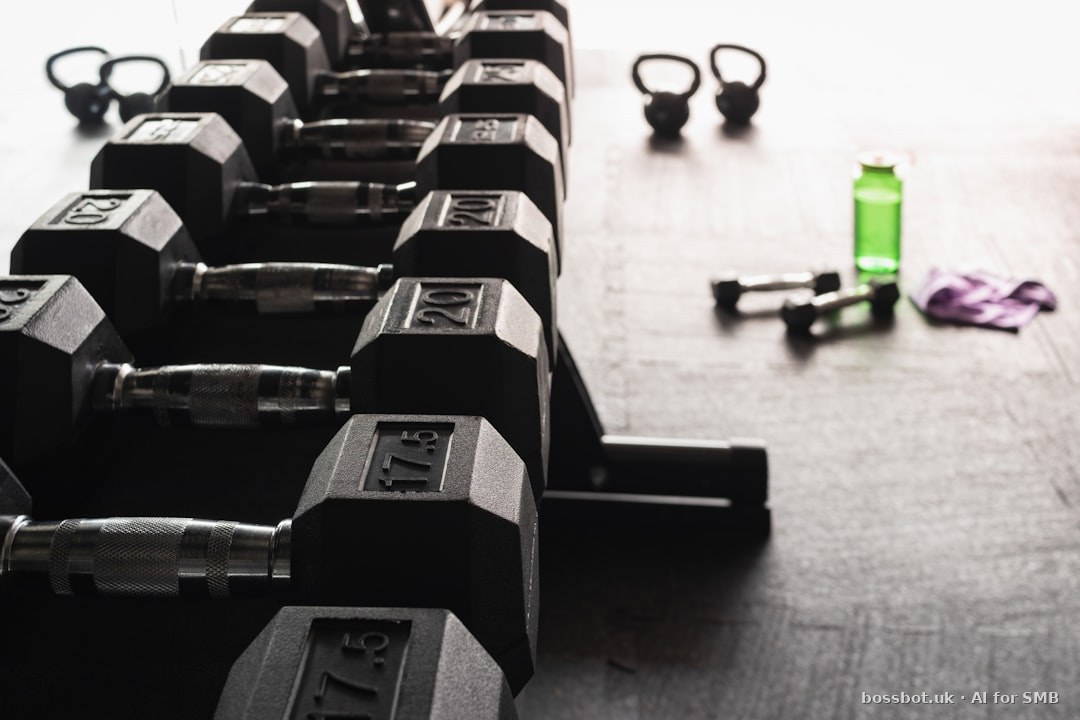 Black and gray dumbbells on floor