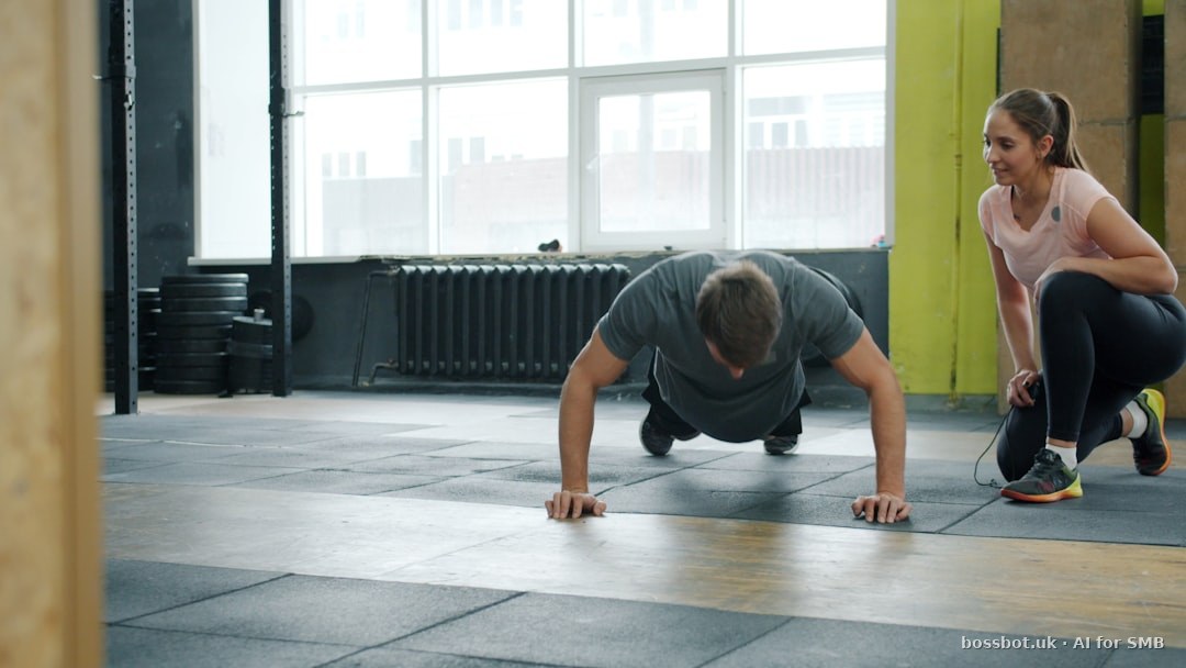 Man does push-ups with woman spotting him.