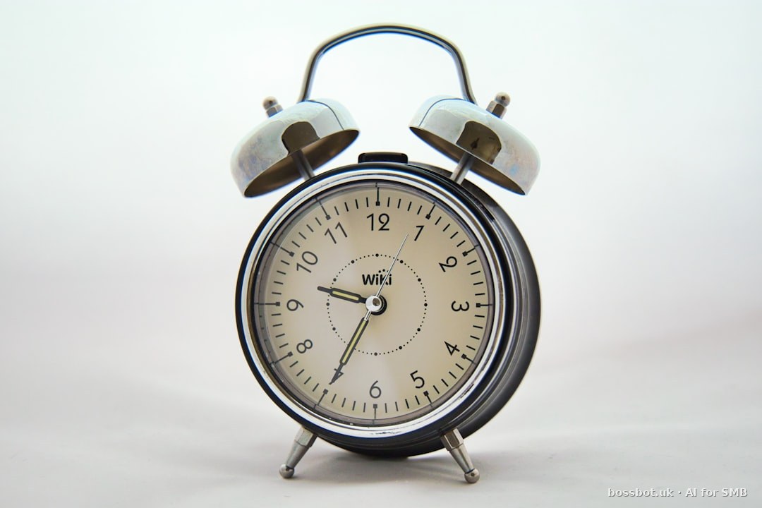 An alarm clock with two bells on each of it's sides