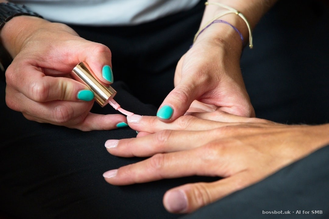 A person's hands with painted nails