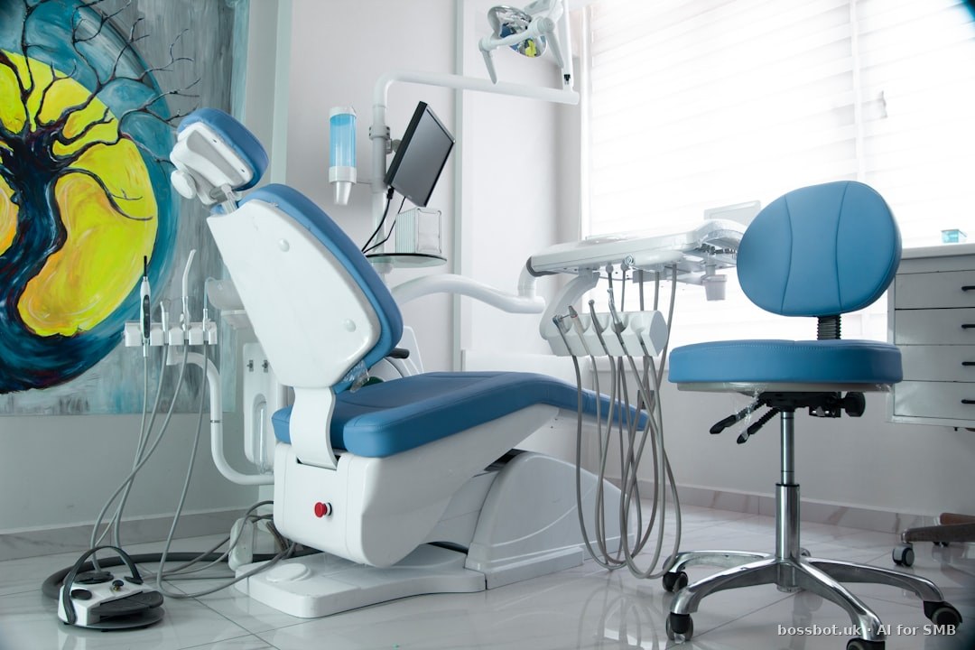 A dentist chair in a room with a painting on the wall