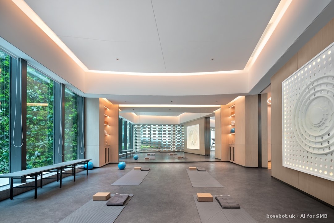 Modern yoga studio with large windows and mats.