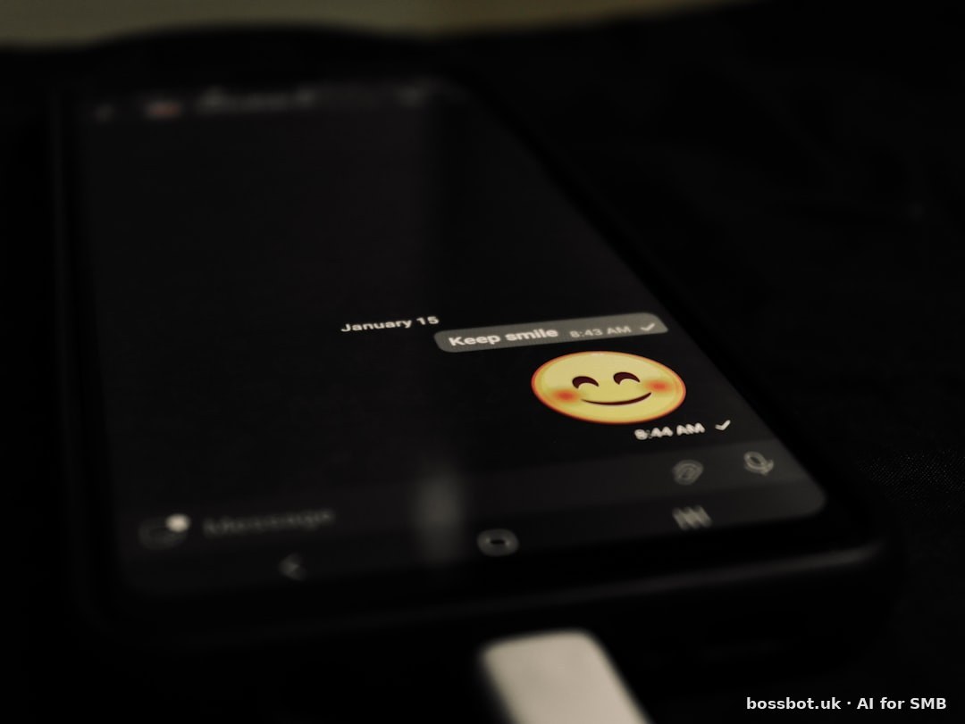 A cell phone with a smiley face on the screen