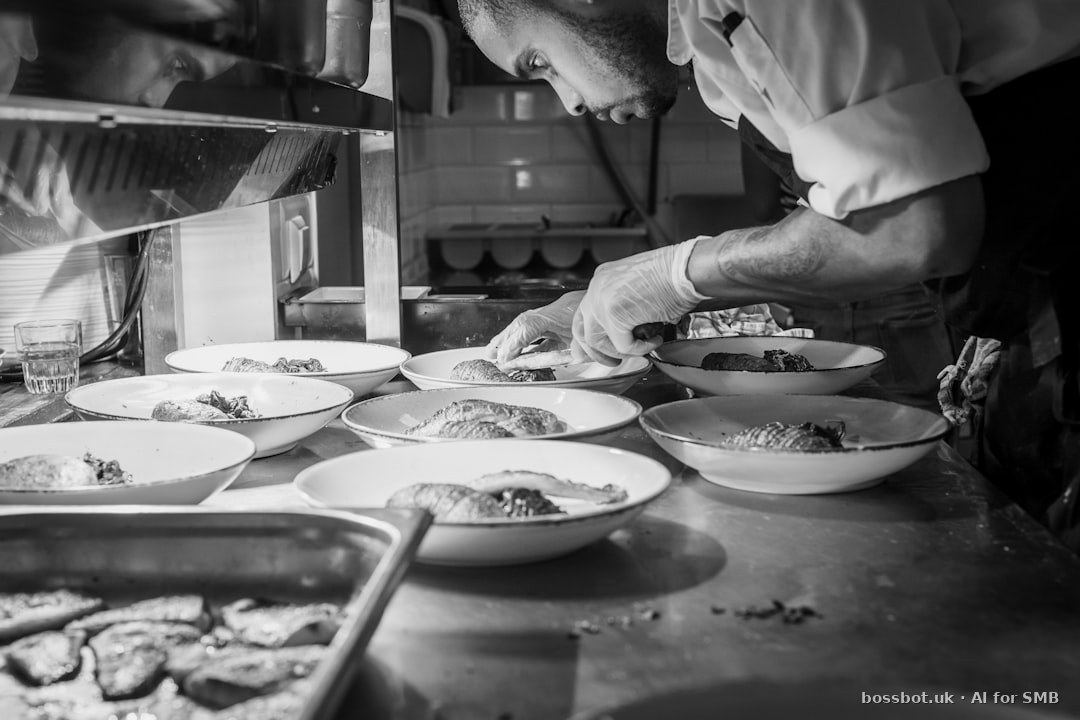 Grayscale photography of person doing plating of dishes